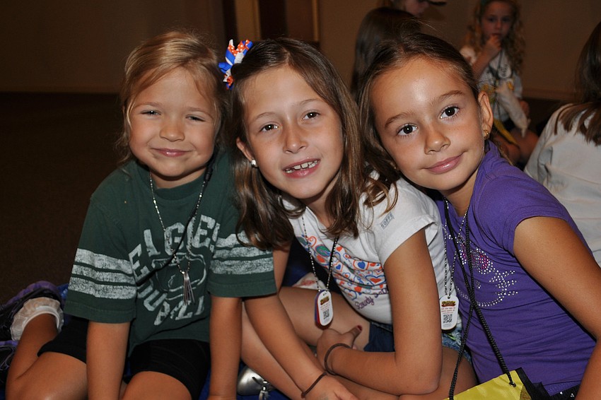 Emma Grace Kelly, Leah Troiano and Parker Haught snack on popcorn.