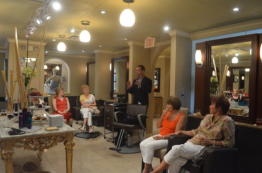 Owner Geoffrey Michel talks to ladies about the menâ€™s services at The Met.