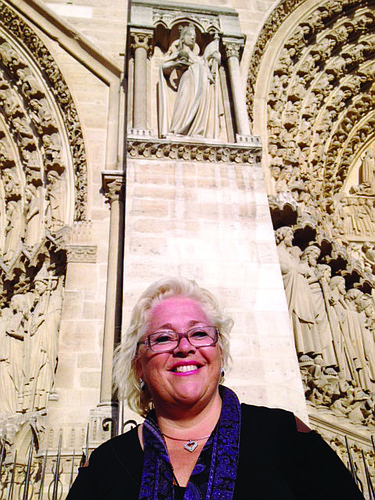 Julie Aranibar stands outside the Notre Dame Cathedral, in Paris.