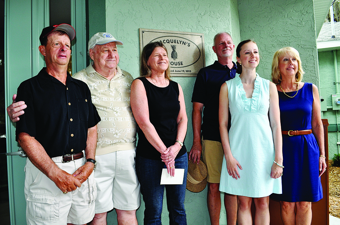 The Niesen family gathers in front of the home named in honor of the family matriarch, the late Jacquelyn Niesen. Pictured are Michael, Jim, Cher, Charles, Fallon and Sandra.
