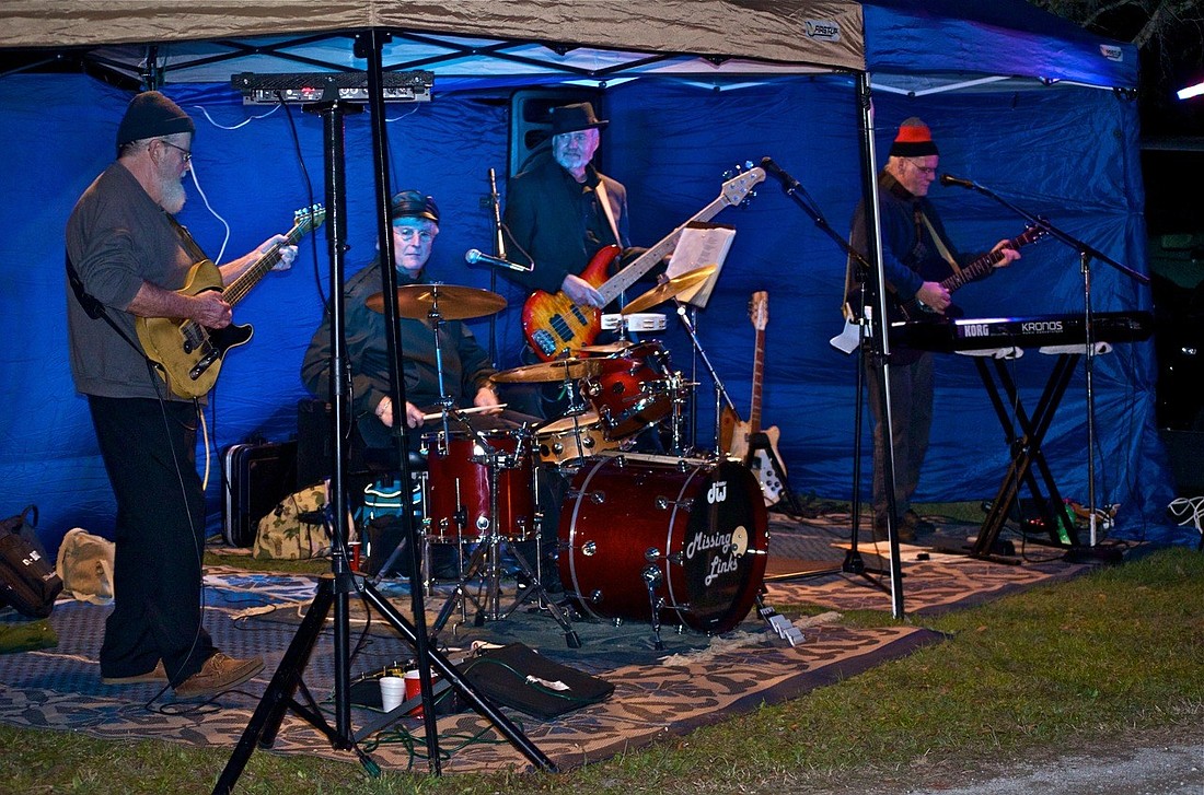The Missing Links decided to keep playing after being reunited at high school reunion performance. Here they are shown playing at a bonfire in February. Courtesy photo