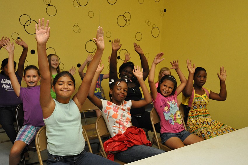 The girls team readies for a game of â€œstay-in-your-chairâ€ volleyball.
