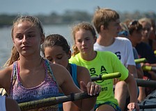 Natalie Rolfs gets ready to row with fellow campers.