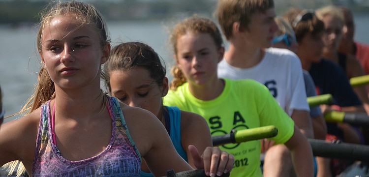 Natalie Rolfs gets ready to row with fellow campers.