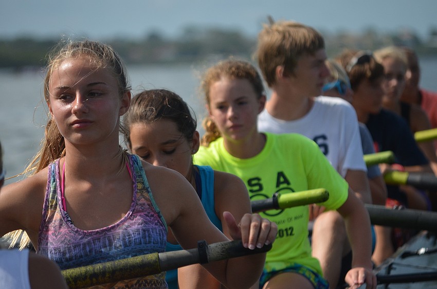 Natalie Rolfs gets ready to row with fellow campers.