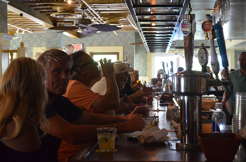 The bar at Tommy Bahama was packed with people for the extended happy hour from 3 to 7 p.m.