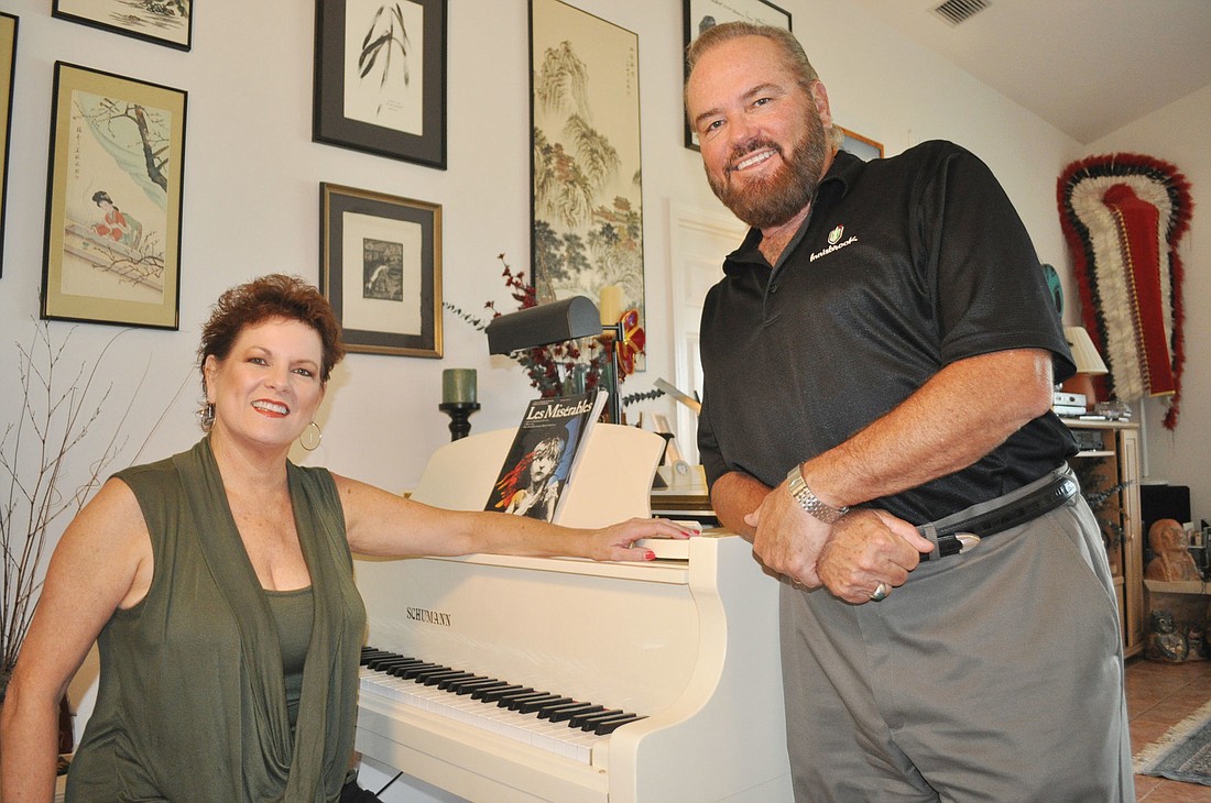 Carol Sparrow and Randolph Locke teach performers from the comfort of their home, where they have two pianos and high ceilings. Exotic artifacts, from their time singing across the globe, decorate their walls.