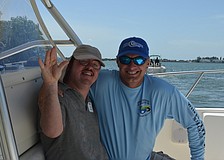 Scott Stottlemyer helped Josh Compton on the fishing trip. Compton caught eight fish including trout and ladyfish.