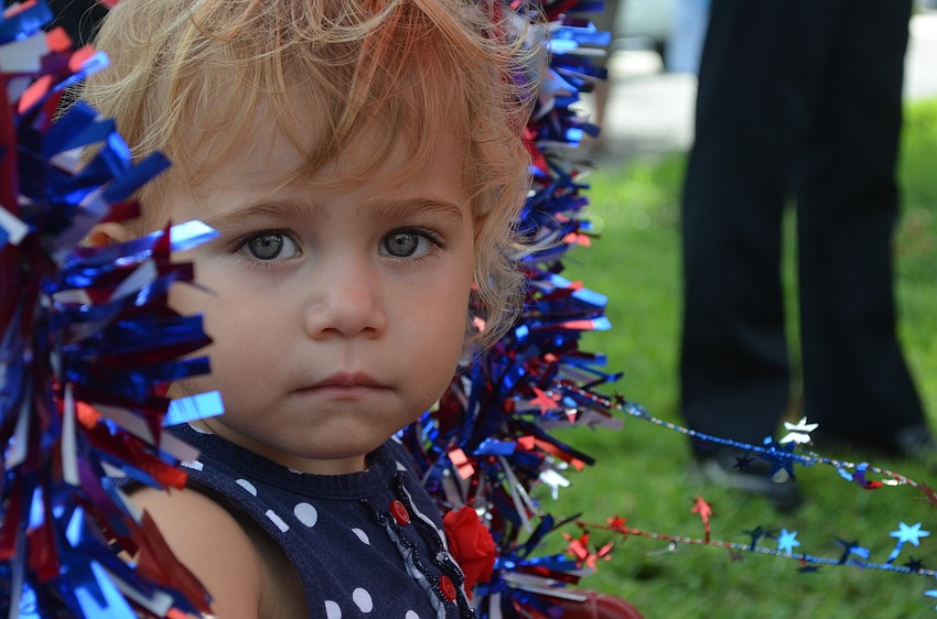 Blaise Fluker, 21 months, rides in a wagon in the parade.