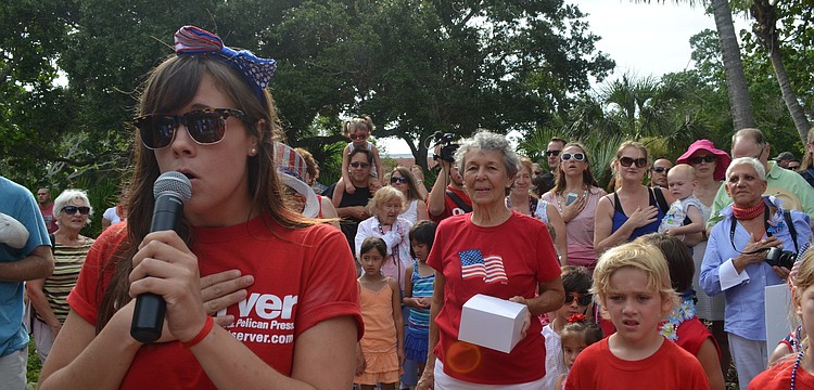 Mallory Gnaegy sings the national anthem at Freedom Fest.
