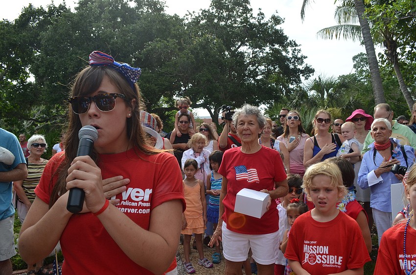 Mallory Gnaegy sings the national anthem at Freedom Fest.