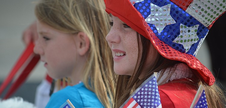 Sara Green, 6, and her sister Izzy, 8, celebrate in patriotic attire.