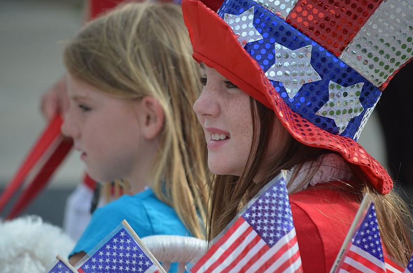 Sara Green, 6, and her sister Izzy, 8, celebrate in patriotic attire.