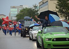Nik Wallenda waves to Sarasotans who welcome him home after he crossed the Grand Canyon earlier last week.