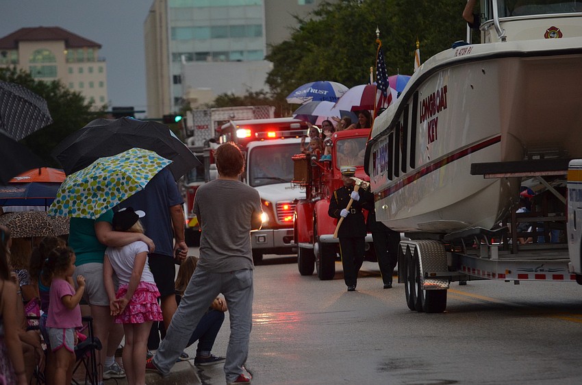 Thousands of people watched boats pass by at the parade.