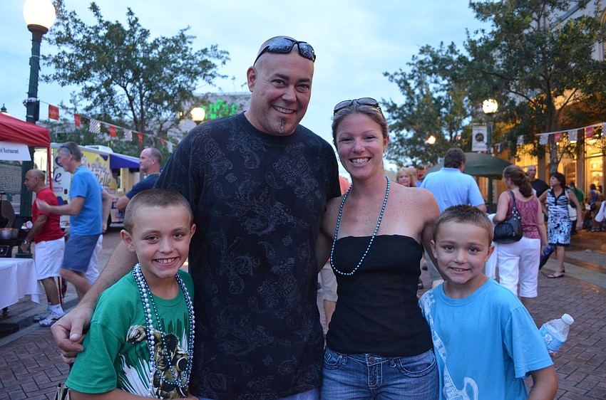 Tasman Henry, 5, and her little brother Kepler with their grandfather John Childers