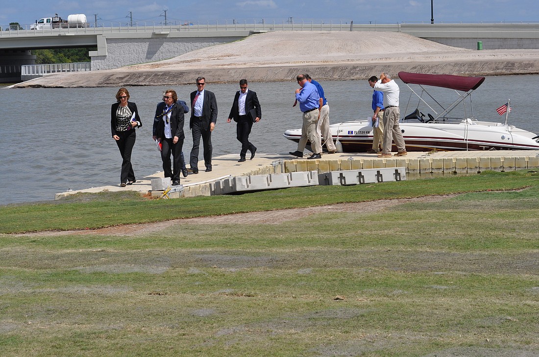 Representatives from the International Federation of Rowing Association tour Nathan Benderson Park in April.