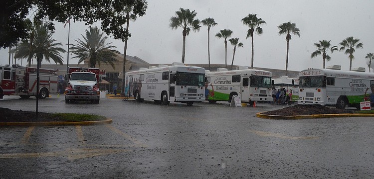 Summer rain sporadically pours down on the blood drive.