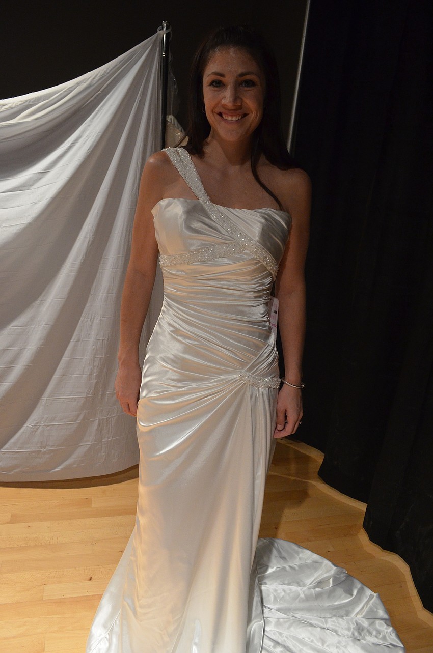 Nicole Pffeiffer tried on dresses for the first time at the bridal show. She will be married in October of 2014.