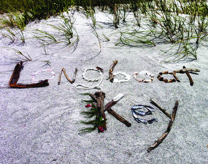 Nancy Wood used the debris that washed up on the beach across from Bayport Beach & Tennis Club, where she stayed, to spell out the name of her vacation spot: Longboat Key.