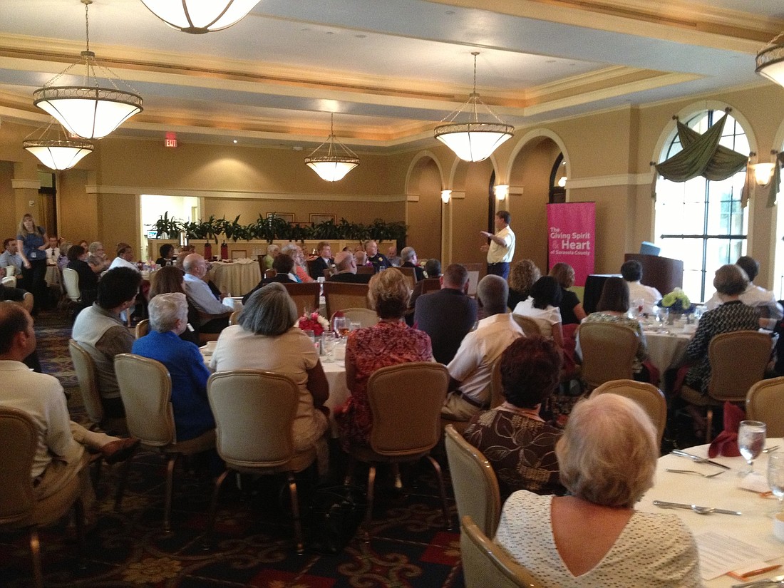 Sarasota County political and business leaders pack the Venetian Golf and River Club to hear Dr. Robert Marbut speak July 18.