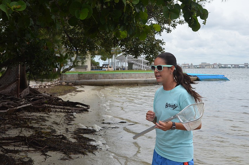 Kelly Munch teaches girls about critters in the bay.
