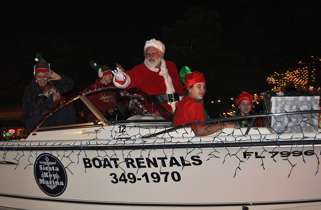 Santa rode in parade in style during the 2012 Siesta KeyÃ¢â‚¬â„¢s Light Up the Village parade.