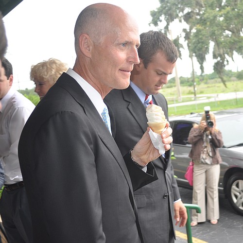 Before he left, Gov. Rick Scott managed to get a scoop of Mixon's famous orange-swirl ice cream.