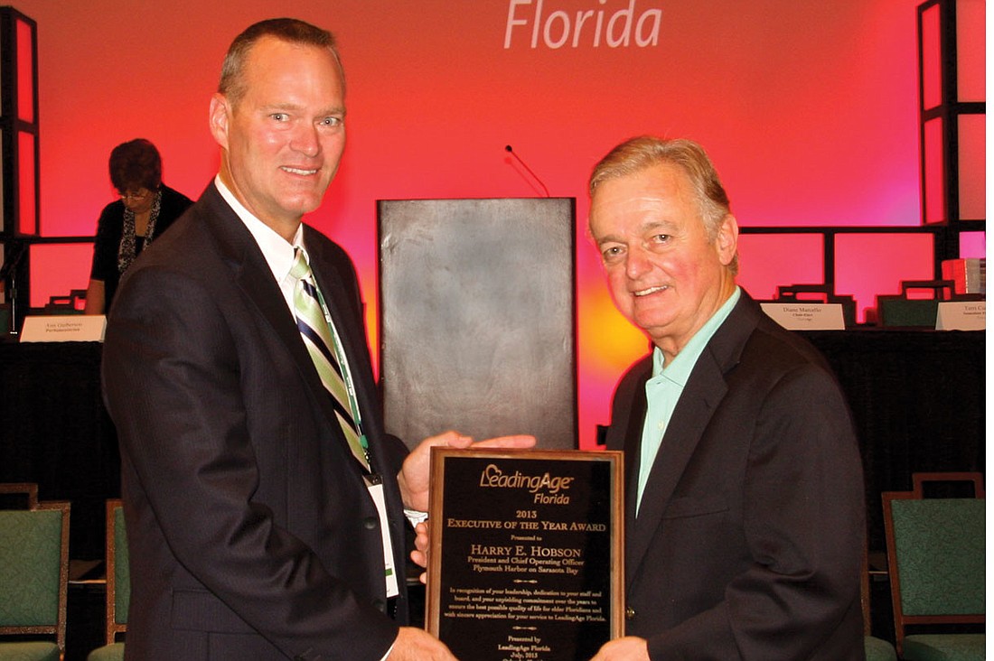 George Bryan, vice chair of the Central Florida Region of LeadingAge Florida, with Plymouth Harbor CEO Harry Hobson. Courtesy photo.