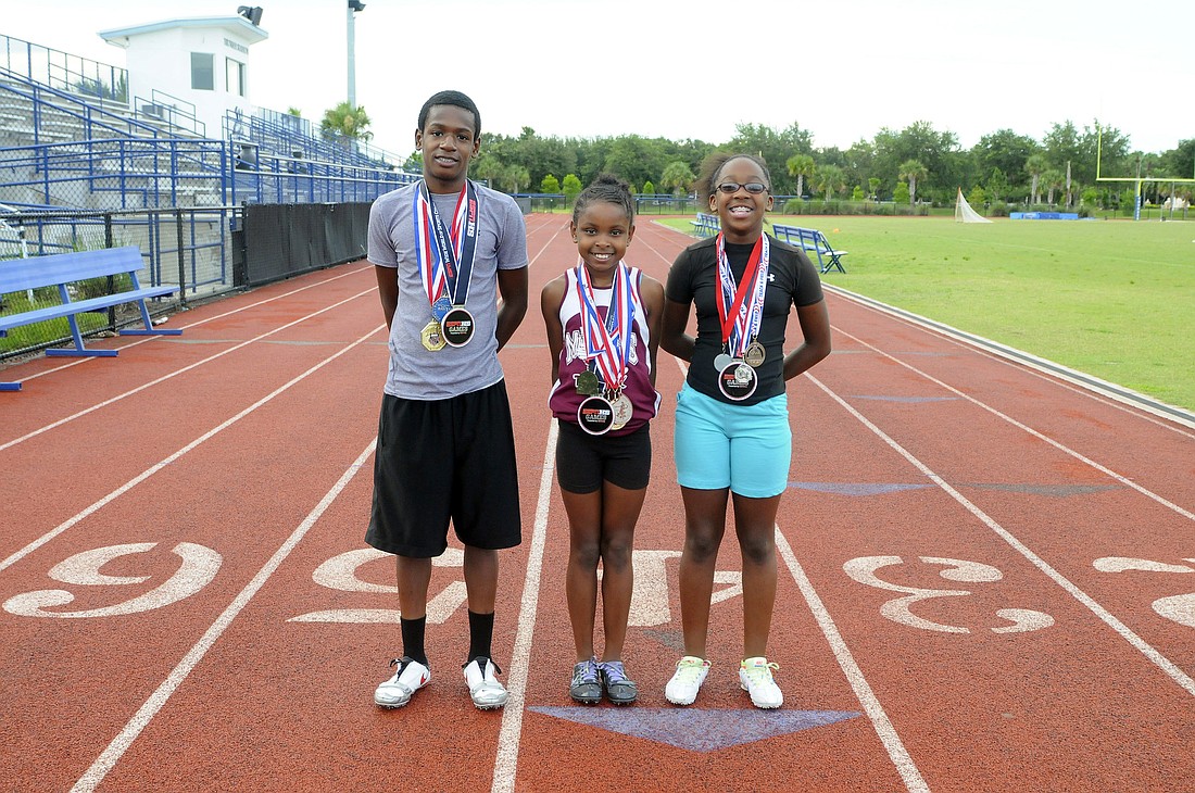 Tyler Stevenson, Alexis Graham and Saraiah Walkes run for the Manatee Mustangs Track Club, which ODA strength-and-conditioning coach Rod Miller coaches.