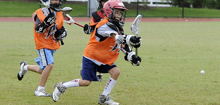 Eight-year-old Oliver Girad attempts a shot.