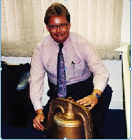 Former Longboat Key Police Lt. John Kintz poses with the recovered Bicentennial Liberty Bell.