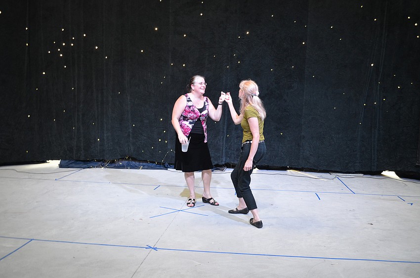 Kyle Turoff shows Beth Duda the new theatre space