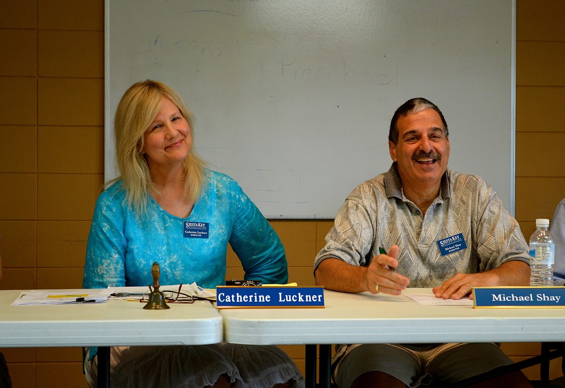 Siesta Key Association board members Catherine Luckner and Michael Shay discuss a proposal to dredge Big Pass.