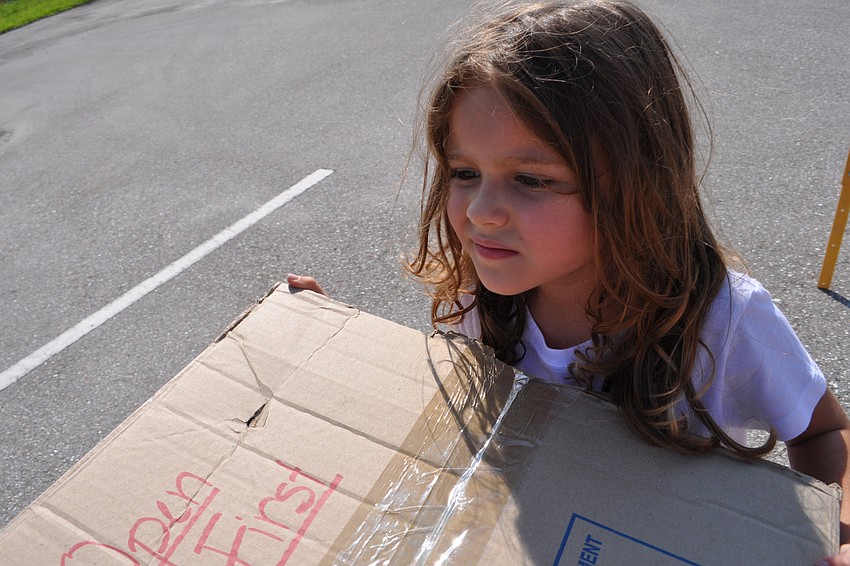 Athena Henson, 4, helps to build the wall of Jericho.