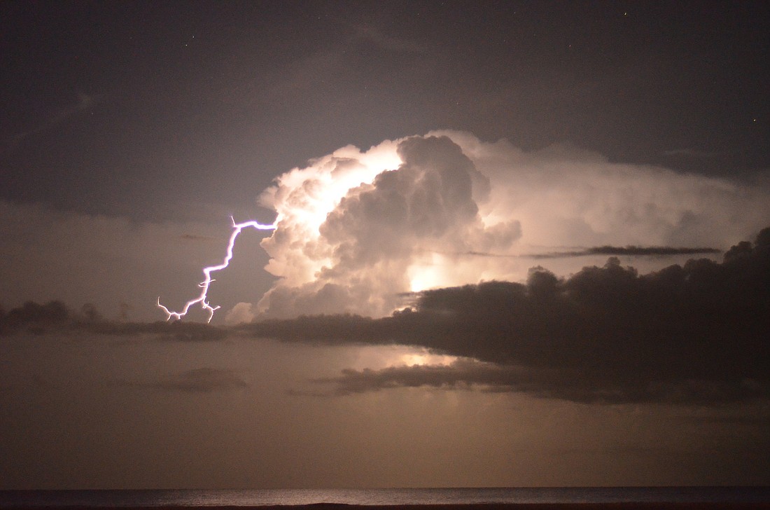 Lightning lit up the sky 1 a.m. Monday, Aug 12, at Siesta Key Beach as stargazers looked for shooting stars at the Perseid meteor shower.