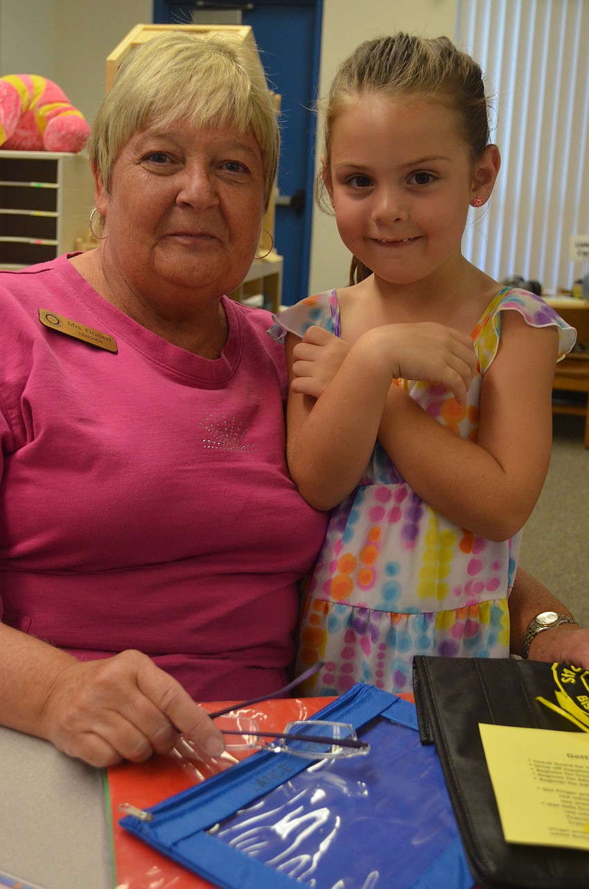 Alyssa Liga, 5, meets her new kindergarten teacher Donna Grabert. Grabert has been teaching at St. Martha for 23 years.