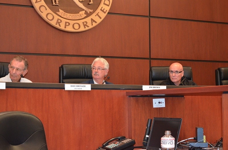 Mayor Jim Brown, center, cast the deciding vote Monday that approved two additional retirement incentives for general employees before their pension plan is frozen next month.