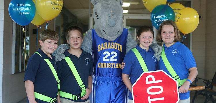 Fifth graders Dru Cappar, Josh Streitmatter, Blaze the mascot, Paige Palmer and Faith Rice