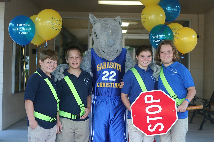 Fifth graders Dru Cappar, Josh Streitmatter, Blaze the mascot, Paige Palmer and Faith Rice