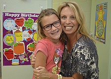 Kylie Giasson and first-grade teacher Amy Pedler