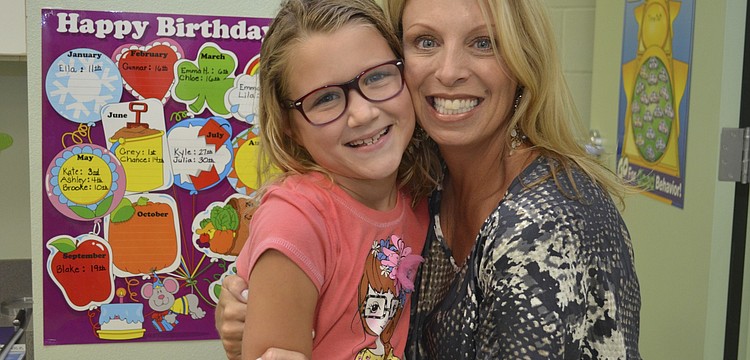 Kylie Giasson and first-grade teacher Amy Pedler