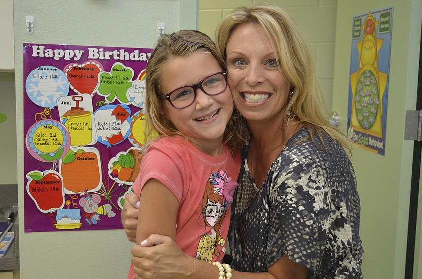 Kylie Giasson and first-grade teacher Amy Pedler