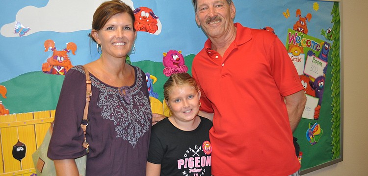 Melissa and Kevin Redman with their son, Karson a fourth grader at Tara Elementary