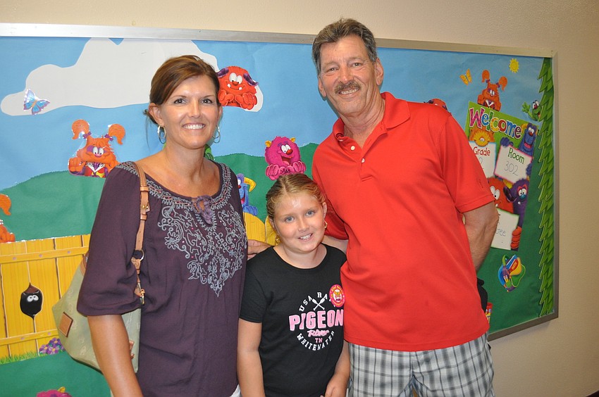 Melissa and Kevin Redman with their son, Karson a fourth grader at Tara Elementary
