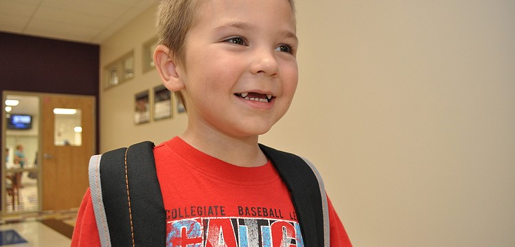 Gullett Elementary kindergarten student Bradley Brewer, 5,  was eager to get to his new classroom.