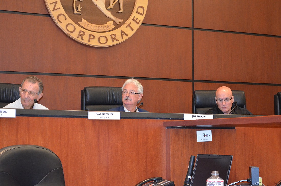 Mayor Jim Brown, middle, cast the deciding vote Monday that approved two additional retirement incentives for general employees before their pension plan is frozen next month.