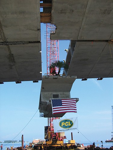 PCL Civil Constructors placed a palm tree on the last segment of the bridge as it was hoisted into place, symbolizing the firm had completed the project.
