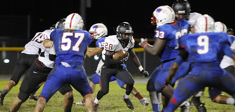 Junior tailback Caleb Ford looks for a running lane in the second half.