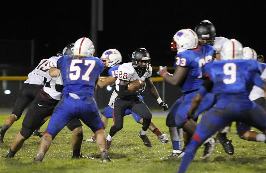 Junior tailback Caleb Ford looks for a running lane in the second half.